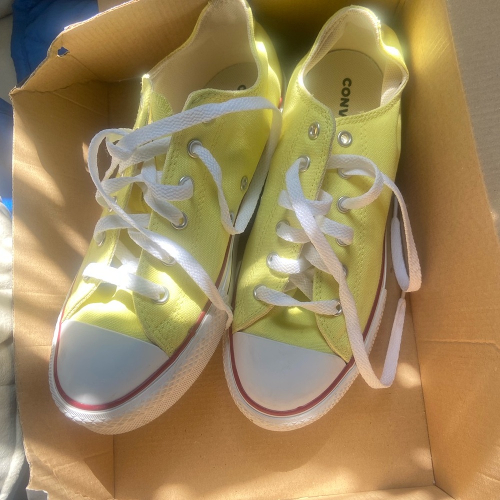 Yellow low top Chuck Taylors